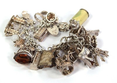 Lot 753 - A silver curblink bracelet with padlock clasp...