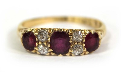 Lot 754 - An 18ct yellow gold ring set three graduated...