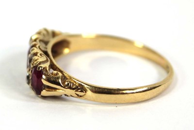 Lot 754 - An 18ct yellow gold ring set three graduated...