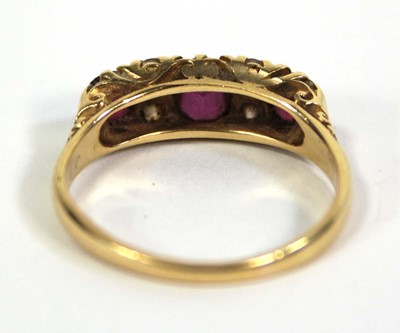 Lot 754 - An 18ct yellow gold ring set three graduated...