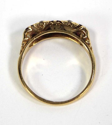 Lot 754 - An 18ct yellow gold ring set three graduated...