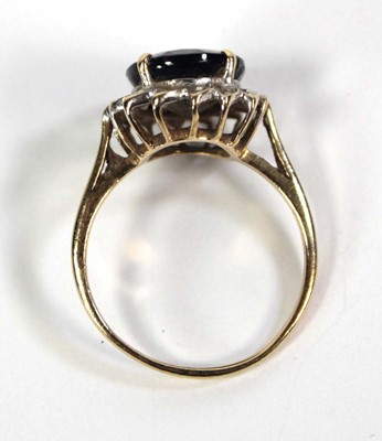 Lot 755 - A 9ct yellow gold cluster ring set oval...