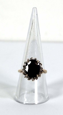 Lot 755 - A 9ct yellow gold cluster ring set oval...