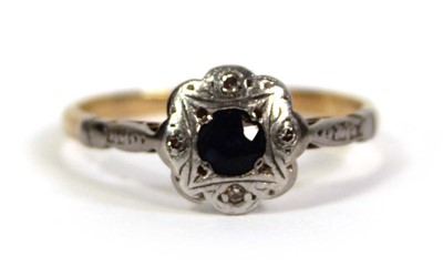 Lot 756 - An 18ct yellow gold ring set small sapphire...