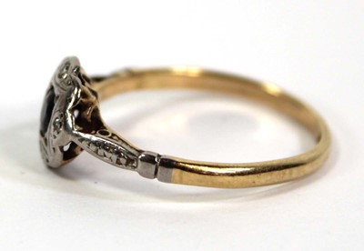 Lot 756 - An 18ct yellow gold ring set small sapphire...