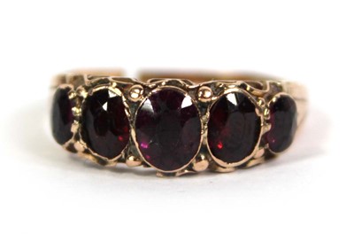 Lot 757 - A 9ct yellow gold ring set five graduated...