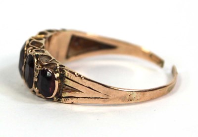 Lot 757 - A 9ct yellow gold ring set five graduated...