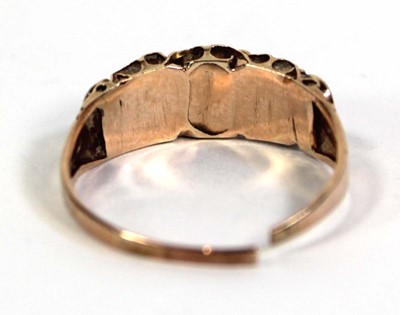Lot 757 - A 9ct yellow gold ring set five graduated...