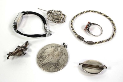 Lot 762 - Seven items of silver and metalware jewellery...