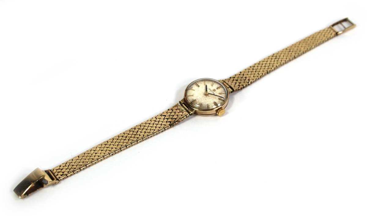 Lot 477 - A ladies 9ct yellow gold wristwatch by Omega,...