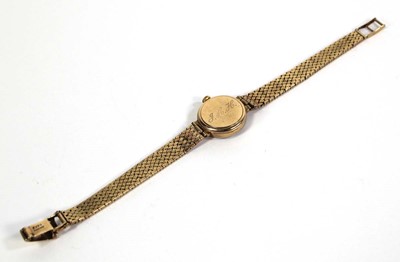 Lot 477 - A ladies 9ct yellow gold wristwatch by Omega,...
