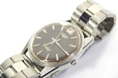 Lot 479 - A stainless steel automatic Conquest...