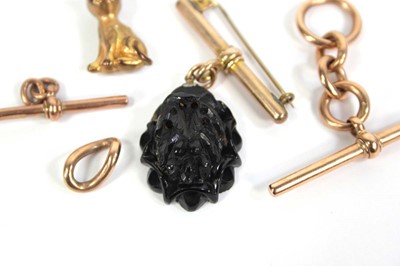 Lot 767 - Two 9ct rose gold t-bars, a 9ct chain link, a...