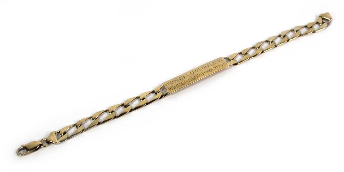 Lot 770 - A 9ct yellow gold flat curblink identity...