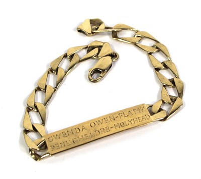 Lot 770 - A 9ct yellow gold flat curblink identity...