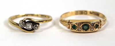 Lot 774 - An 18ct yellow gold crossover ring set three...