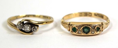 Lot 774 - An 18ct yellow gold crossover ring set three...