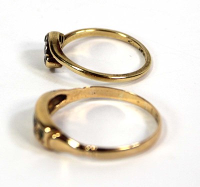 Lot 774 - An 18ct yellow gold crossover ring set three...