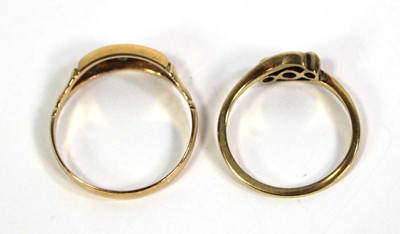 Lot 774 - An 18ct yellow gold crossover ring set three...