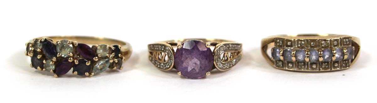 Lot 775 - Three 9ct yellow gold rings set small diamonds,...