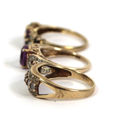 Lot 775 - Three 9ct yellow gold rings set small diamonds,...