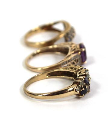 Lot 775 - Three 9ct yellow gold rings set small diamonds,...