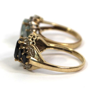 Lot 776 - Two 9ct yellow gold rings, each set blue...