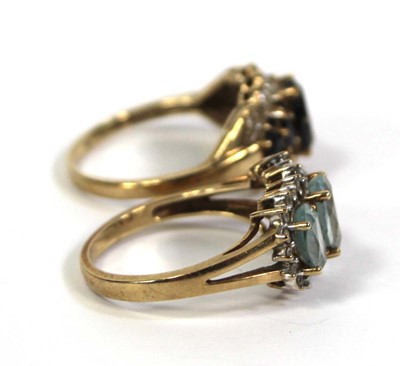 Lot 776 - Two 9ct yellow gold rings, each set blue...