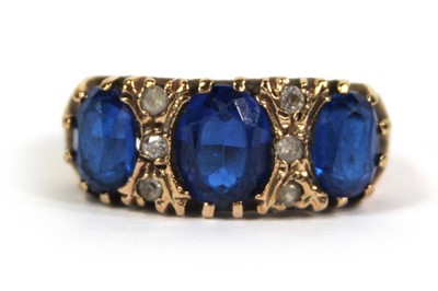 Lot 777 - A 9ct yellow gold dress ring set three oval...