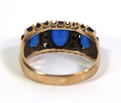 Lot 777 - A 9ct yellow gold dress ring set three oval...