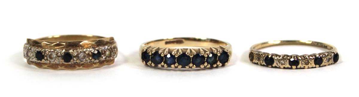 Lot 778 - Three 9ct yellow gold half eternity rings,...