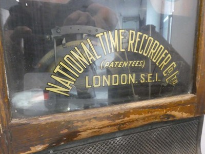 Lot Dark oak cased clocking in machine by National...
