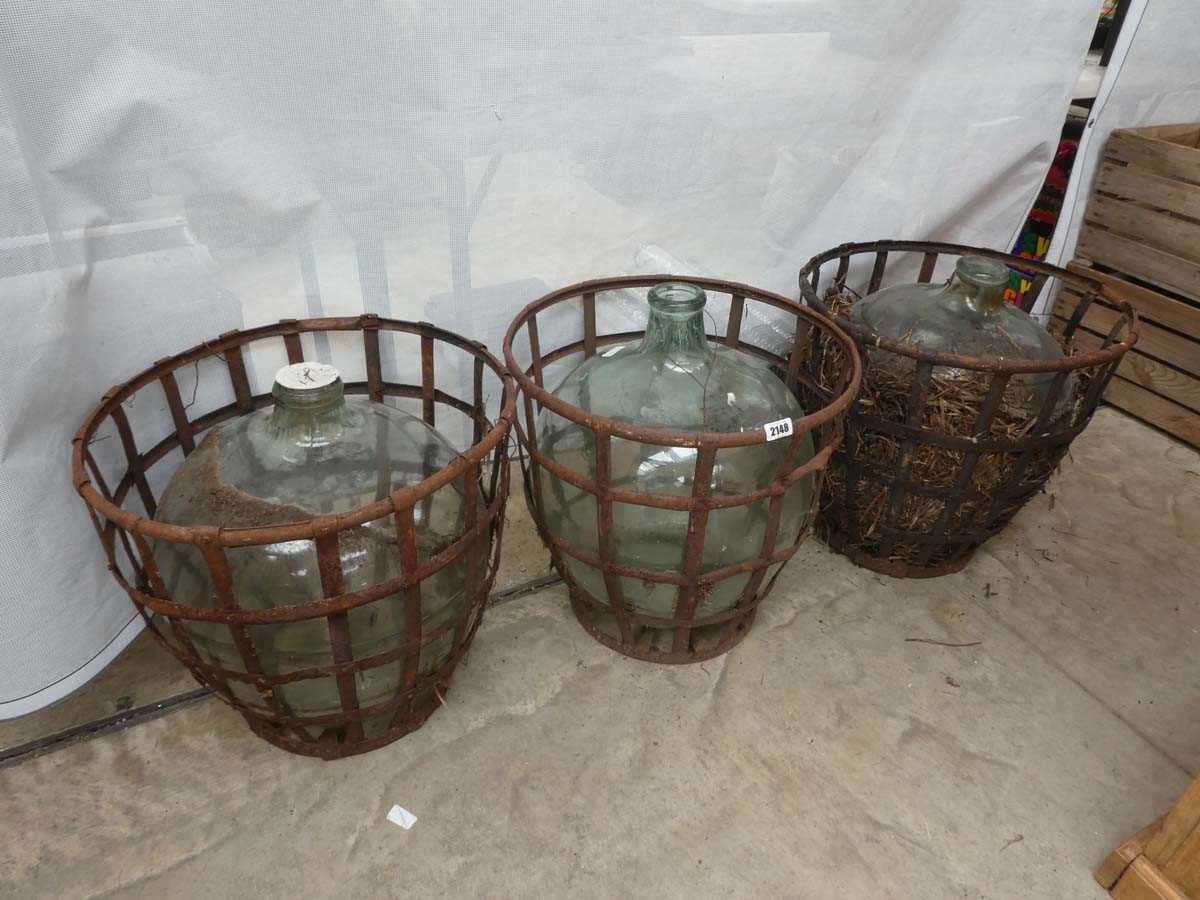Lot 3 glass car buoys in wrought iron frame baskets