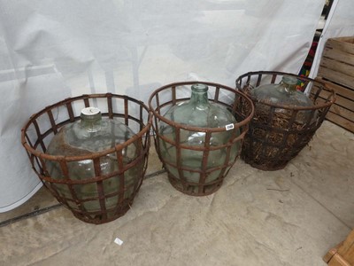 Lot 3 glass car buoys in wrought iron frame baskets