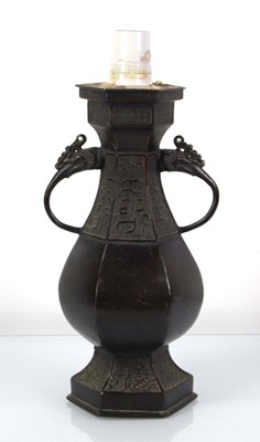 Lot 52 - A brown-patinated spelter table lamp base...
