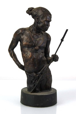 Lot 59 - A bronzed figure of a Native American wearing...