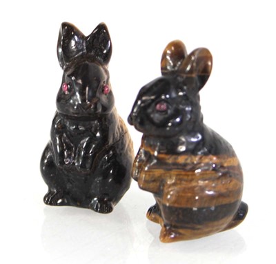 Lot 94 - A pair of tiger's eye figures modelled as...