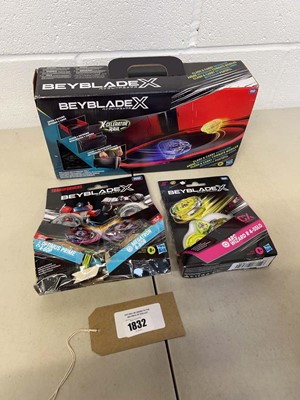 Lot 1832 - Small selection of Beyblade to include...