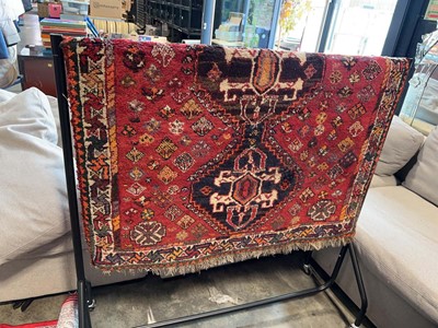 Lot 1649 - Red figured and bordered rug