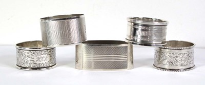 Lot 356 - Four silver napkin rings, various design,...