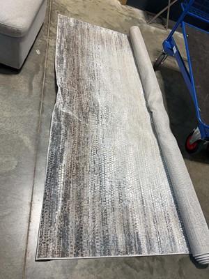 Lot 1653 - Calvin Klein large area rug on a shimmering...