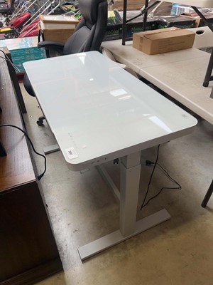 Lot 2897 - Tresanti glass top electric height rising desk