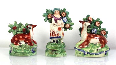 Lot 210 - A bocage figure modelled as a female and her...