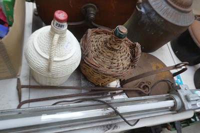 Lot 2301 - 2 glass carbuoys in baskets with wrought iron...