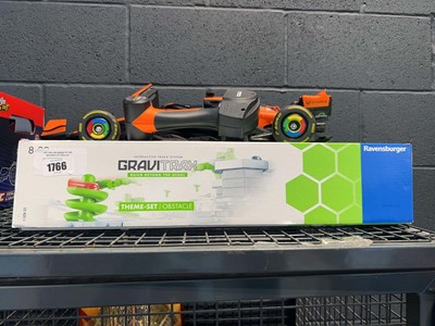 Lot 1766 - 2 remote control F1 racing cars and Gravitrax kit