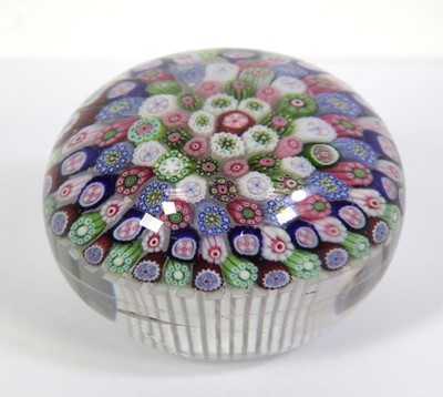 Lot 211 - A millefiori multi-canework paperweight in the...