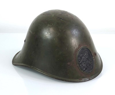 Lot 124 - A Second World War Dutch M34 combat helmet
