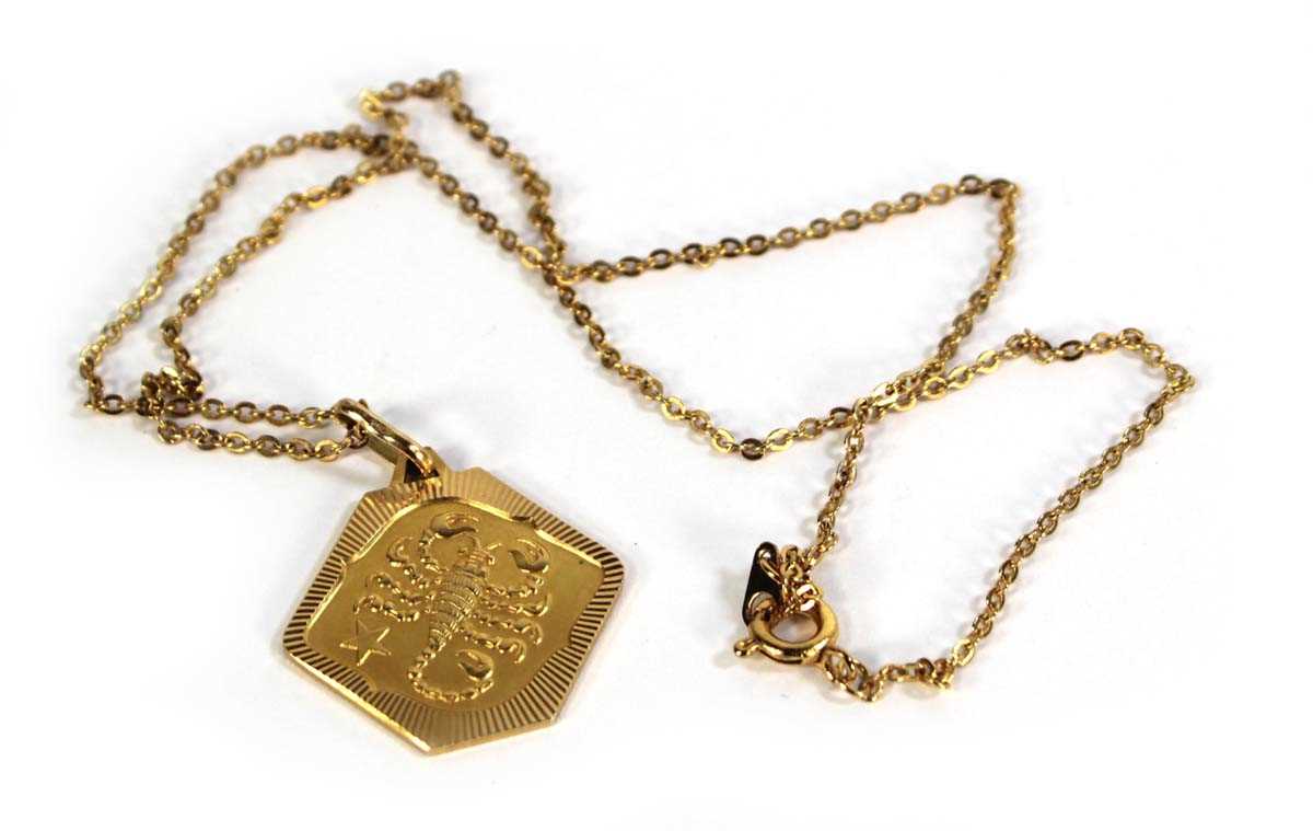 Lot 786 - A yellow metal chainlink necklace suspending...