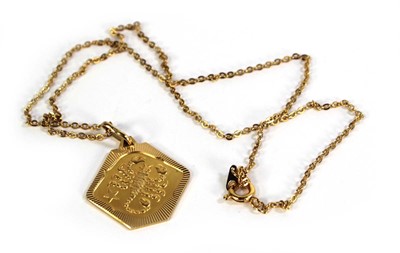 Lot 786 - A yellow metal chainlink necklace suspending...