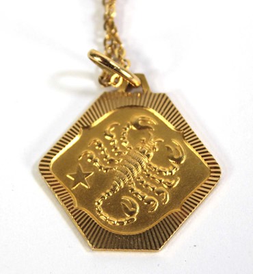 Lot 786 - A yellow metal chainlink necklace suspending...